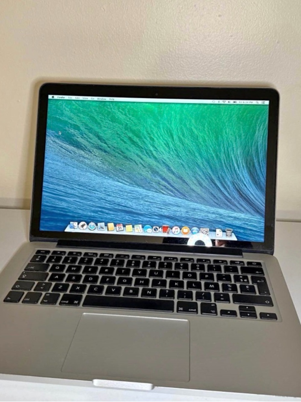 Apple MacBook Pro Silver with Black Keyboard and Green-Blue Display